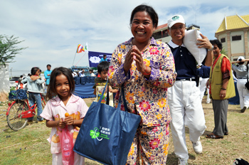 Aid Distribution Brings Smiles to Cambodian Flood Victims